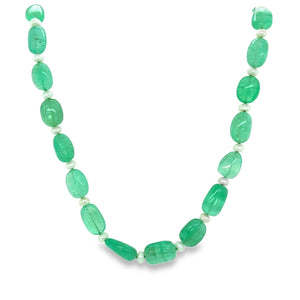 Necklace with emerald beads on a white background