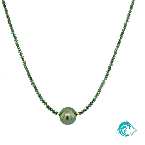 Green beaded necklace with a large green bead on a white background